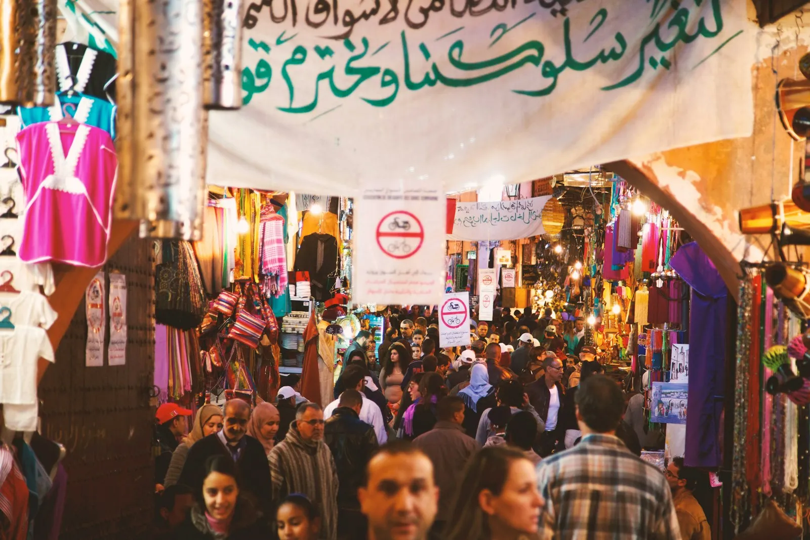 Food stalls glowing with smoke and lanterns at the Jemaa el-Fna night market in Marrakech